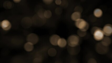 Wall Mural - abstract bokeh background animation with fast flickering defocused warm golden bokeh light spheres. 