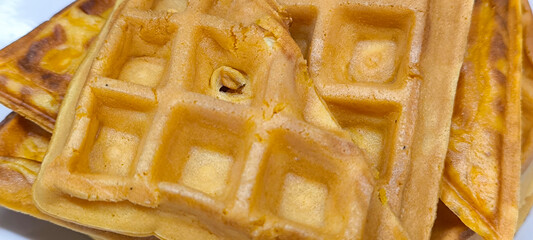 Wall Mural - Yellow waffles in a white plate