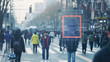 A crowd of people on the street and a facial recognition camera running it. Surveillance and information collection. Cutting-edge technology monitoring public gatherings.