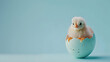 A cheerful chick emerging from a delicately speckled eggshell against a backdrop of serene light blue, with ample copy space