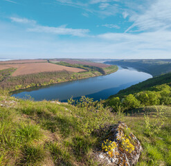 Wall Mural - Amazing spring view on the Dnister River Canyon with picturesque rocks, fields, flowers. This place named Shyshkovi Gorby,  Nahoriany, Chernivtsi region, Ukraine.