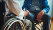 © Vesna - The doctor and patient are both in wheelchairs, discussing medical treatment. Comforting, empathy. Disability concept.