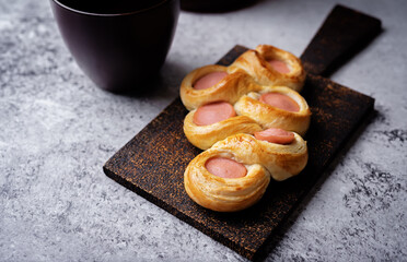 Wall Mural - Baked sausage bread Hotdog on a wood cut board