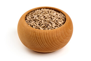 Wall Mural - Peeled sunflower seeds in wooden bowl, isolated on white background.