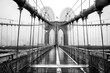 Brooklyn bridge, New York City. USA. New York in a foggy day in downtown Manhattan. Black and white image.