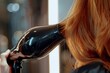 Elegant Hair Styling at Home - Woman drying her long, auburn hair with a modern hairdryer, a home beauty routine