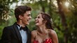 © GB - Outdoor portrait of a young couple dressed up for their high school prom and laughing together