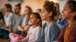 © Laura - Parents and children attending a workshop on mindfulness and emotional intelligence, learning techniques for managing stress and fostering resilience, love, respect, tolerance, edu