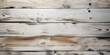 Whitewashed wood planks background. Light wooden texture with subtle grain and knots. Shabby chic and contemporary home design concept with space for text.