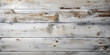 Whitewashed wood planks background. Light wooden texture with subtle grain and knots. Shabby chic and contemporary home design concept with space for text.