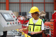 © sittinan - worker or engineer working in factory with safety uniform , safety hat and safety glasses , image is safety concept or happy workplace