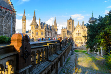 Wall Mural - View of the Kornmarkt area from Saint Michael's Bridge including the towers of the Post Building, Ghent Belfry, St. Nicholas Church, and Saint Bavo's Cathedral.