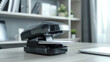 The electric stapler in action effortlessly fastening multiple pages with a satisfying click.