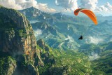 A brave paraglider fearlessly soars through the air above a vibrant, verdant valley.