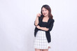 © Ajab - Beautiful Asian Indonesian girl in her 20s in the office surprised with arms crossed and pointing at the camera isolated on a white background