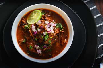 Wall Mural - Bowl of Mexican Beef Birria Stew on Black Plates