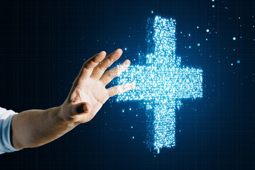 Hand reaching towards a glowing digital plus sign, healthcare technology concept on a dark blue background