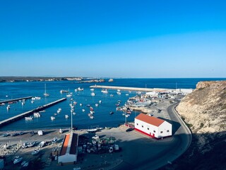 Wall Mural - View to the small dock with yachts and boats, ocean coast, blue sky