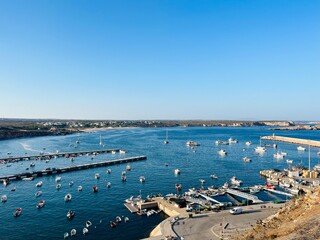 Wall Mural - View to the small dock with yachts and boats, ocean coast, blue sky