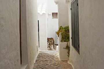 Exterior Spanish architecture and building design of The quaint old fishing village of Binibeca Vell (Binibèquer Vell), white houses form a small labyrinth of narrow, cobbled corridors- Menorca, Spain