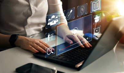 Wall Mural - e-learning education, internet lessons and online webinar. person who attends online lessons on a di