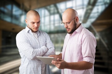 Poster - Two colleagues discussing something in office