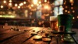 Celebratory St. Patrick's Day setting with a pint of beer, leprechaun hat, gold coins, and shamrocks on an old wooden table, with a blurred pub background and space for text