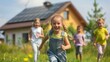 happy children running in front of a house with solar energy panels