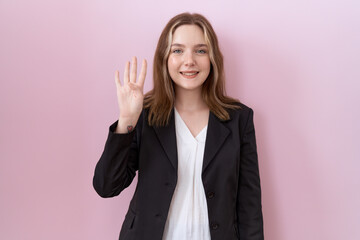 Canvas Print - Young caucasian business woman wearing black jacket showing and pointing up with fingers number four while smiling confident and happy.