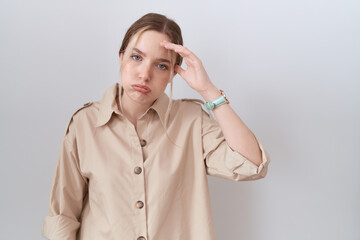 Poster - Young caucasian woman wearing casual shirt worried and stressed about a problem with hand on forehead, nervous and anxious for crisis