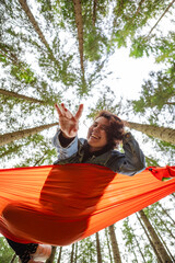 Poster - happy woman on hammock in the forest