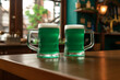 Mugs of cold green beer on the pub table, st. patrick's day celebration