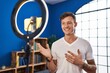 © Krakenimages.com - Young man having video call standing at home