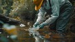 A scientist releasing fish into a rehabilitated river ecosystem to restore biodiversity