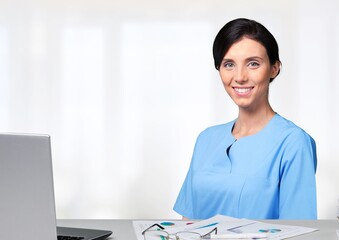 Canvas Print - Healthcare concept, woman nurse work with laptop