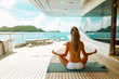 woman practicing yoga on superyacht deck