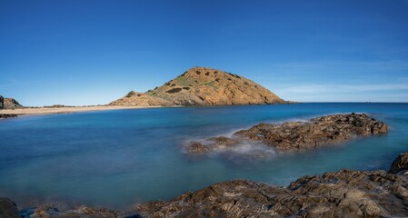 Poster - long exposure view of the bay and beach at Sa Mesquida on Menorca