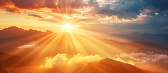 a photo capturing the golden rays of the sun shining through a cloudy sky as it sets over a majestic
