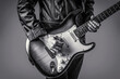 © Yevhen - Hands of a musician playing the electric guitar. Electric guitar, guitarist, musician rock. Guitar acoustic. Play the guitar. Live music. Music festival. Instrument on stage, band. Black and white