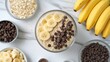 Elegant presentation of overnight oats with a dollop of peanut butter and banana slices, sprinkled with cocoa powder, Banana Oatmeal with Peanut Butter and Chocolate Chips in Ceramic Bow