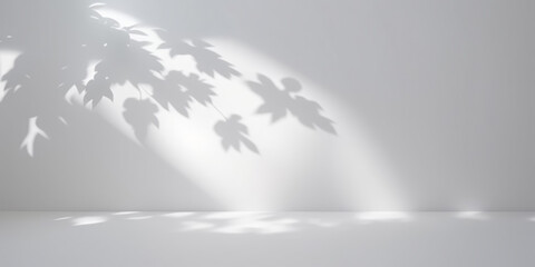 Wall Mural - Minimalistic light background with blurred foliage shadow on a white wall. Beautiful background for presentation.