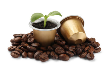 Wall Mural - Green seedling growing in coffee capsule and beans isolated on white