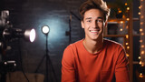 Fototapeta  - Cheerful young man recording podcast in studio with copy space. Smiling caucasian man talking on web radio. Social media influencers or content maker concept in relaxed casual style at home.