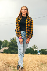 Assured girl outside. Portrait preteen girl on the nature backgr