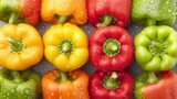 Fototapeta Sypialnia - Vibrant green, red, and yellow bell peppers with water drops on background for vegetable backdrop