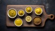 Assortment of different types of mustard with lemon on a cutting Board