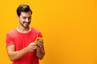 © SHOTPRIME STUDIO - Mobile man smiling communication yellow phone phone copy smartphone space portrait cyberspace happy