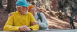 © Daniel - Head shot portrait close up of cute couple of old middle age people having fun and enjoying together in the forest of the mountain at the table relaxing and resting. Mature woman hugging husband love