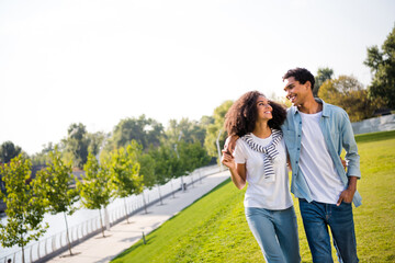 Canvas Print - Portrait of two lovely positive partners embrace beaming smile look each other free time walk downtown park outside