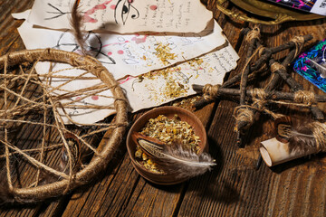 Wall Mural - Witch's magic attributes on wooden table, closeup